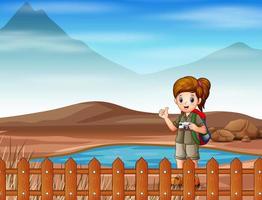A girl scout going for a walk on dry land vector