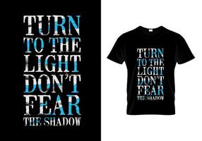 Turn To The Light Don't Fear The Shadow Typography T Shirt Design vector