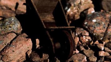 abandoned wooden mine wheelbarrow on rocks video