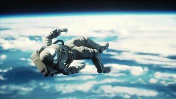 dead astronaut leaving Earth orbit Elements of this image furnished by NASA video