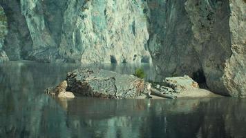 rocky cliffs in the ocean at sunny day video