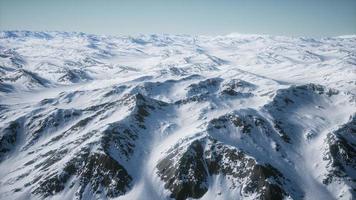 8K Aerial Landscape of snowy mountains and icy shores in Antarctica video