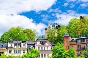 Colorful beautiful traditional buildings in Karlovy Vary Carlsbad historical city centre photo