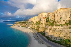 Tropea town colorful stone buildings on top of cliff, Calabria, Italy photo