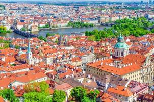 Top aerial view of Prague historical city centre with red tiled roof buildings photo