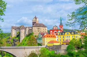 Loket Castle Hrad Loket gothic style building on massive rock, colorful buildings in town photo