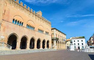 Palazzo dell'Arengo palace building with arches and Pope Paul V statue on Piazza Cavour square photo