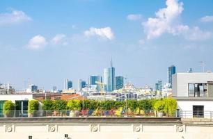 Top aerial view of Milan city centre skyscrapers from roof, Italy photo