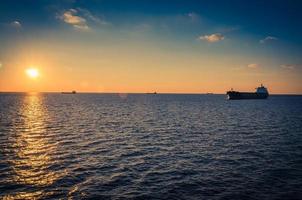 Container ships in the Gulf of Riga and Baltic sea at sunset photo