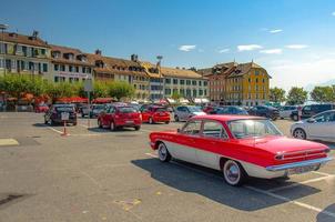 Parking with colourful cars and buildings near the Lake Leman photo