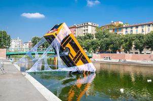 Milan, Italy, bus immersed in lake, spiderman movie advertising photo