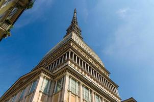 Mole Antonelliana tower building with spire steeple is major landmark and symbol of Turin photo