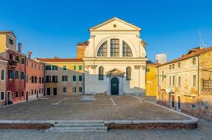 Campo San Trovaso square with Chiesa dei Santi Gervasio e Protasio catholic church in Venice photo