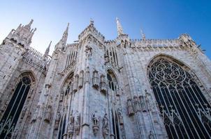 White walls of Duomo di Milano cathedral with high windows, Italy photo