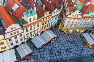 Top aerial panoramic view of Prague Old Town Stare Mesto historical city centre with red tiled roof buildings photo