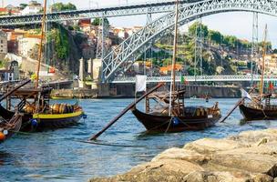 Portugal, Porto, wooden boats with wine barrels on Douro river close up, wooden boats photo