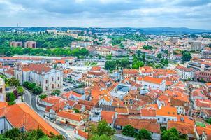 Aerial panoramic view of Leiria city old historical centre with red tiled roofs buildings