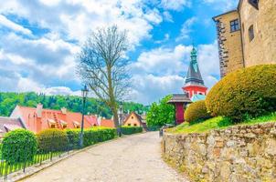 Cobblestone path road to medieval Loket Castle Hrad Loket gothic style building with stone walls photo