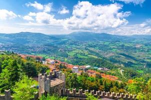 Aerial top panoramic view landscape with valley, green hills, fields, villages of Republic San Marino