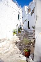 Narrow streets of the town of Ostuni with white buildings in Puglia Apulia region