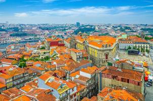 Aerial panoramic view of Porto Oporto city historical centre with red tiled roof typical buildings photo