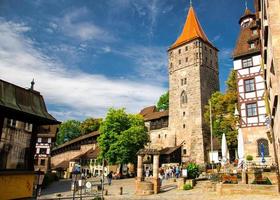 Old medieval Tower Tiergartnertorturm and traditional buildings photo