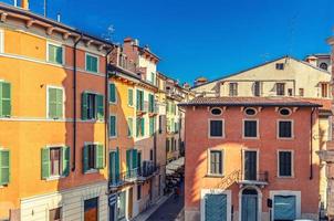 Typical italian street with traditional colorful buildings with shutter windows, aerial view photo