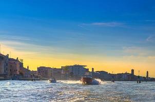 Yacht boats racing sailing on water of Venetian lagoon photo