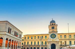 Torre dell'Orologio clock tower with astronomical clock and Loggia del Consiglio building in Padua photo