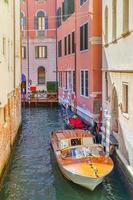 Venice cityscape with narrow water canal photo