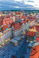 Top aerial panoramic view of Prague Old Town Stare Mesto historical city centre with red tiled roof buildings