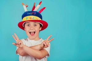 happy boy with birthday hat photo