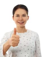 Woman showing thumb up sign isolated on white photo