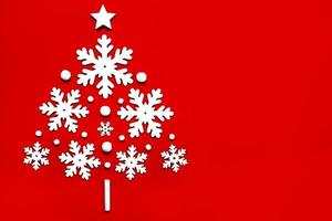 Merry Christmas. Snowflakes in the form of a christmas tree with copy space. Christmas concept background photo