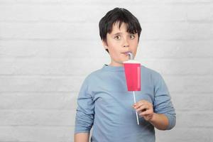 funny child drinking smoothie photo