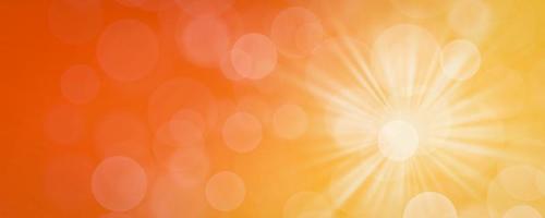 abstract orange backgroundand summer background with light bokeh photo