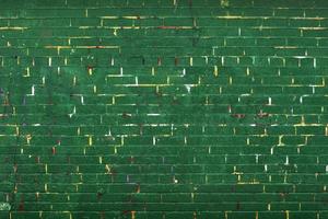 Green brick wall with yellow lines background photo