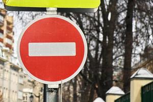 Modern red do not enter road sign with a reflecting surface in Moscow. photo