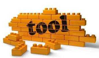 tool word on yellow brick wall photo