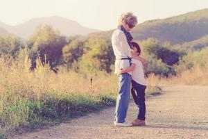 grandmother hugging her grandson photo