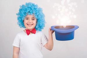 Funny child in carnival on white background photo