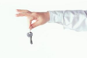 Hand with house key photo