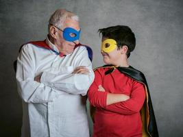 Grandfather With Grandson dressed as a superhero photo