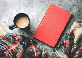 scarf with cup of coffee and book photo