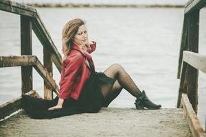 Young Woman sitting on the floor photo