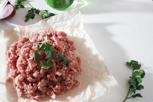 homemade minced pork on parchment paper photo