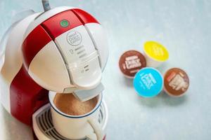 Nescafe Dolce Gusto coffee machine with Nescafe Dolce Gusto capsules. Selective focus photo