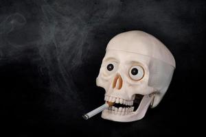 Skull smoking a cigarette photo