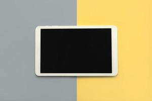 White digital tablet with black screen photo