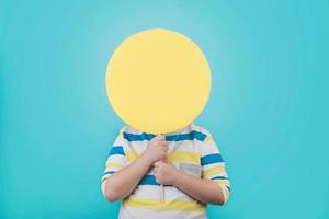 Boy holding a yellow sign photo